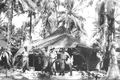 No 77 Squadron Association Los Negros Island photo gallery - Our tent - Los Negros Island June 1944. 77 Squadron's camp site was in a coconut plantation on the sea front.  We had American tents - 5 to a tent.  There were no Australian Navy or Army personnel in the Admiralty Islands (all Yanks)  L to R:  Flying Officer Keith Toupein, U/K, Warrant Officer John Martin and Flying Officer John Brocklehurst.  (Jim Mitchell)